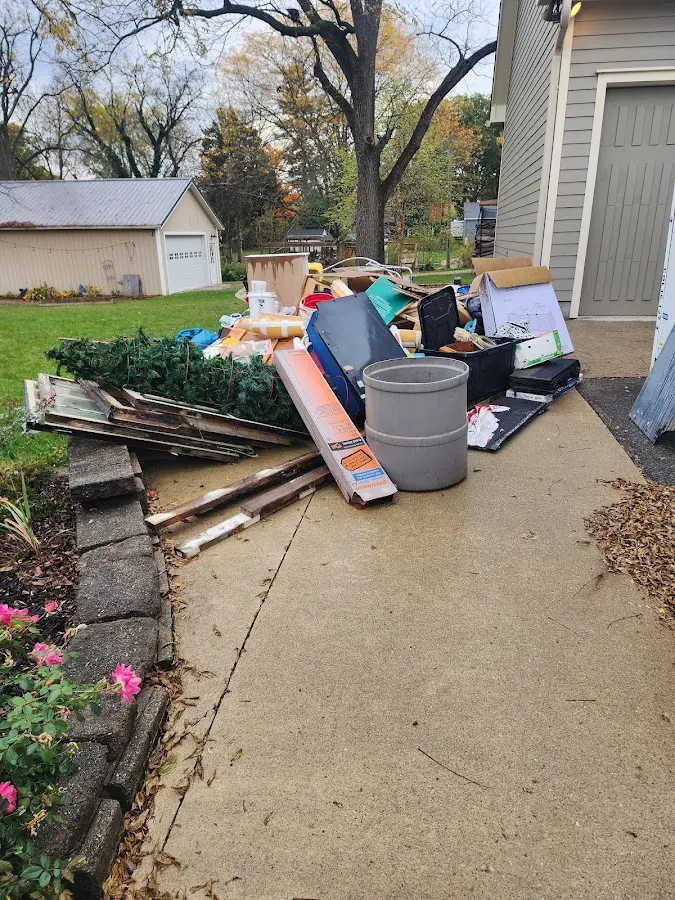 Dumpster being loaded with debris for Residential Dumpster Rental in East Hemet